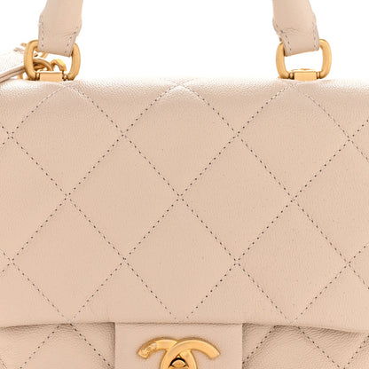 Shiny Caviar Quilted Mini Top Handle Flap Ecru
